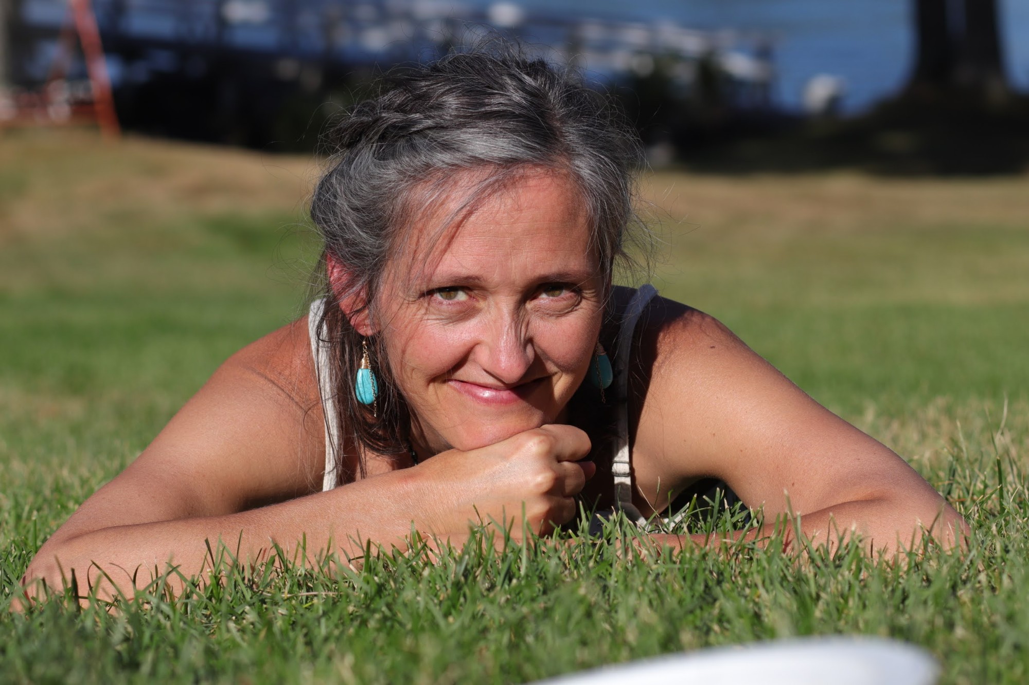Portrait of Mackensie Satya Priya Grant resting in the grass